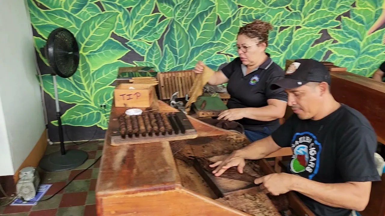 Workers at a cigar-making bench at Doña Elba Cigars in Granada, Nicaragua